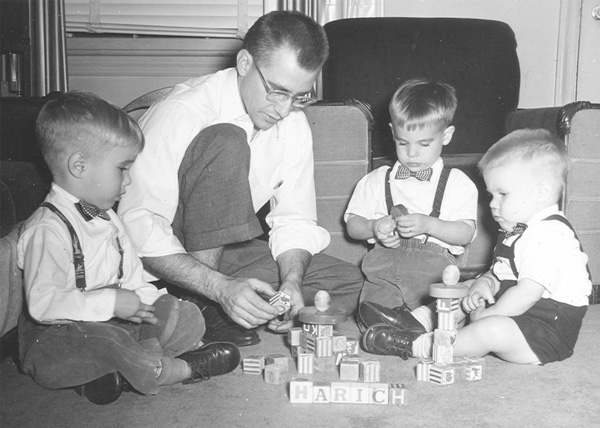 Dad and three boys with blocks